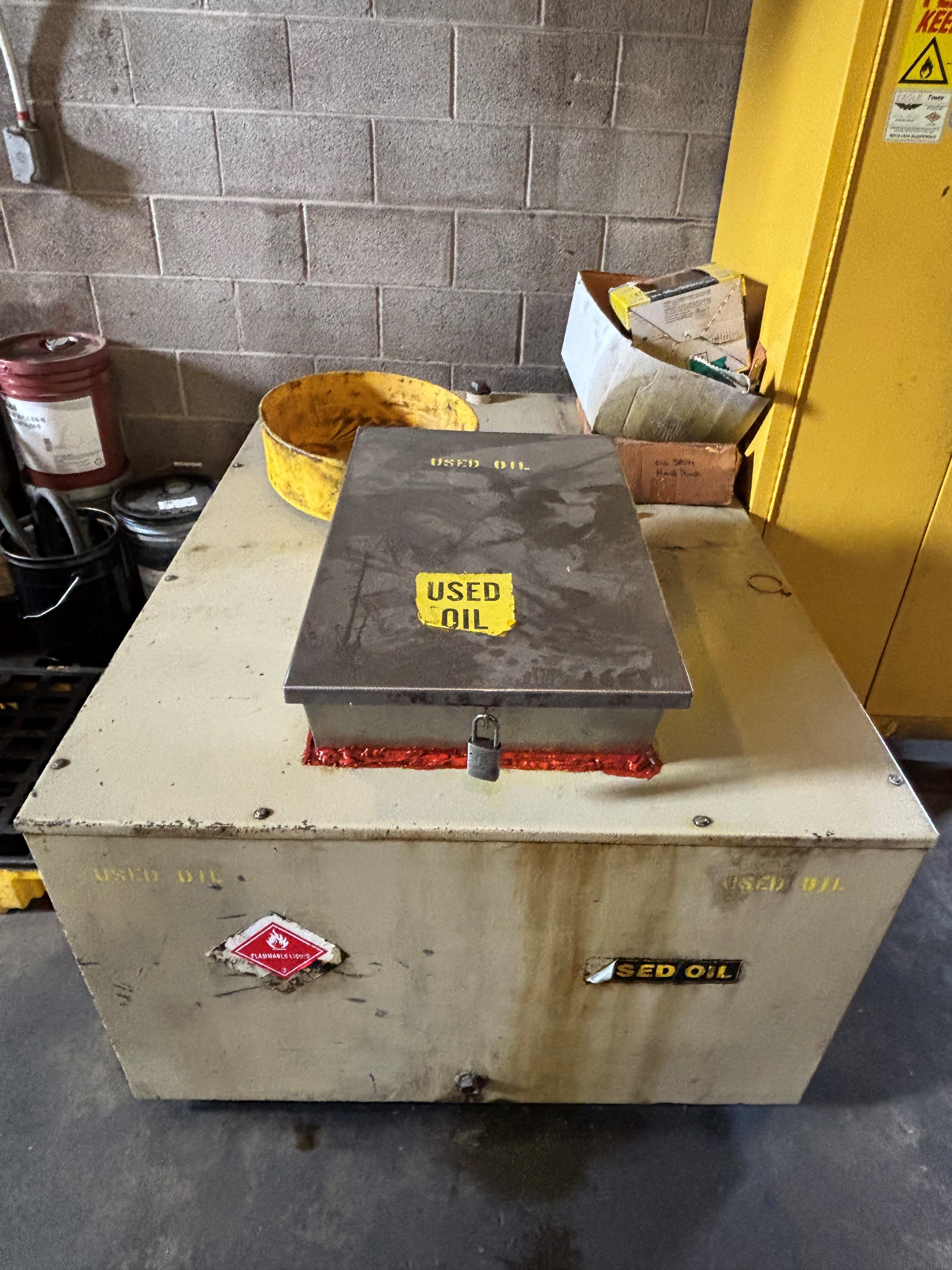 250-gallon tank with used oil labels on sides.